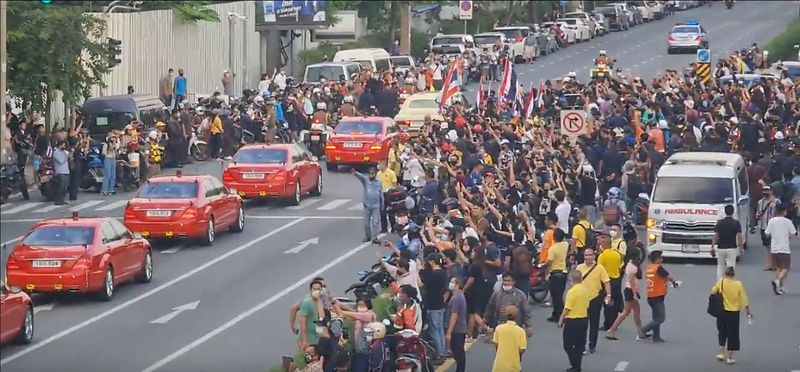 Social media video still of the royal motorcade carrying Thailand’s
