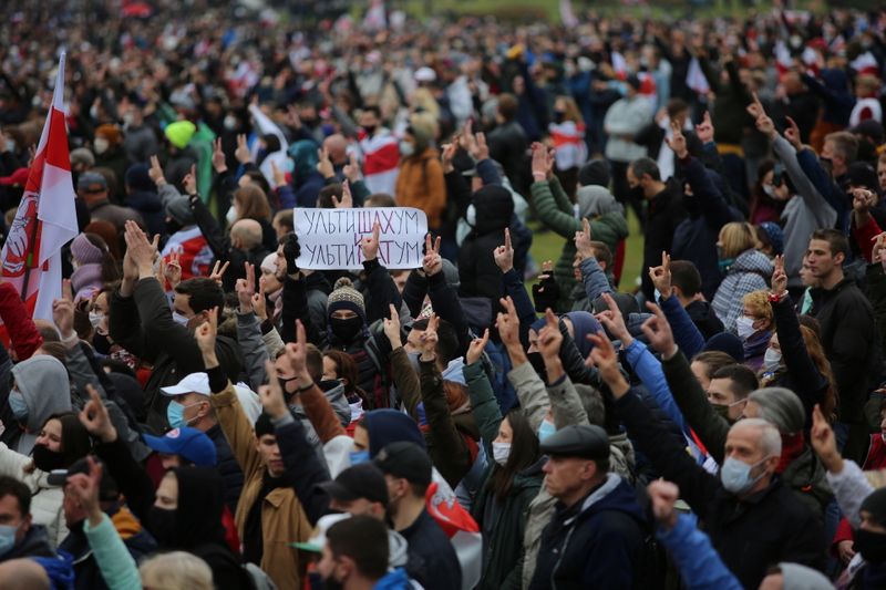 Belarusian opposition supporters hold a rally in Minsk