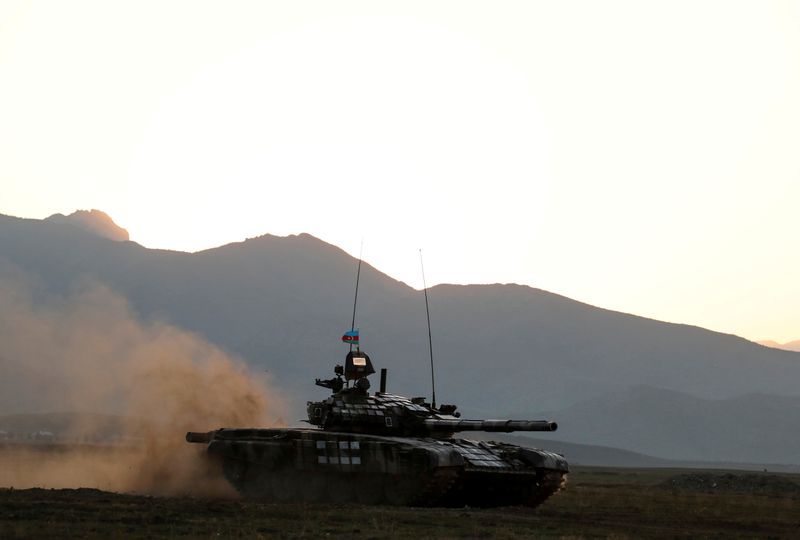 FILE PHOTO: Azerbaijani soldiers maneuver with a tank during a
