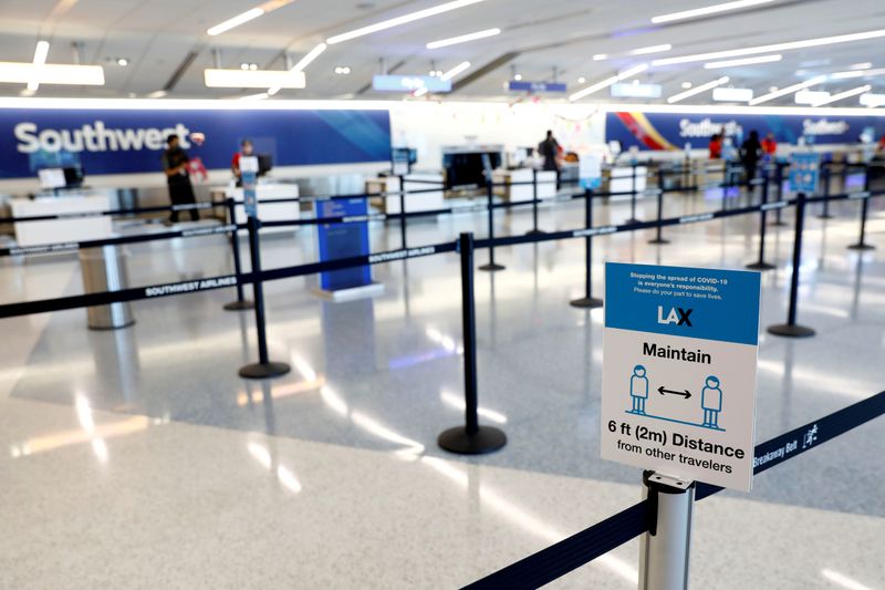 FILE PHOTO: Social distancing sign is displayed at a check-in