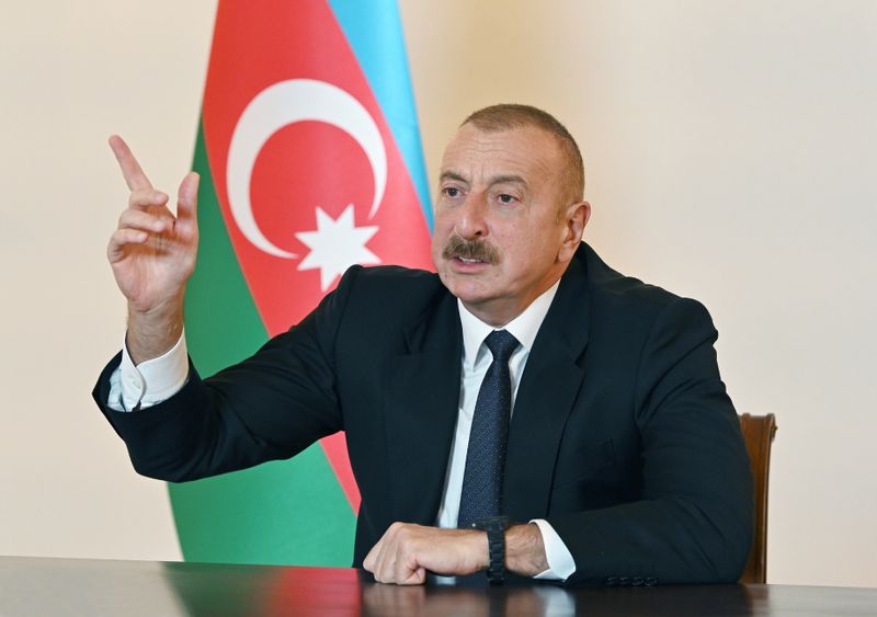 Azerbaijan’s President Ilham Aliyev speaks during an address to the