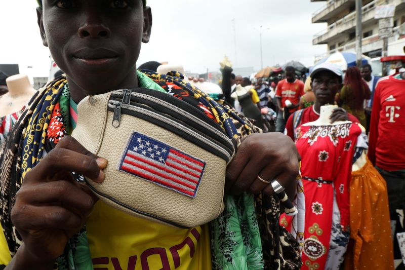 A street vendor shows U.S. flag printed on his bag