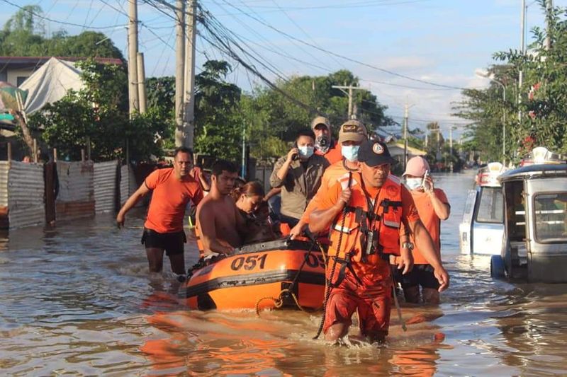 Philippine Coast Guard conduct a rescue operation following Typhoon Vamco