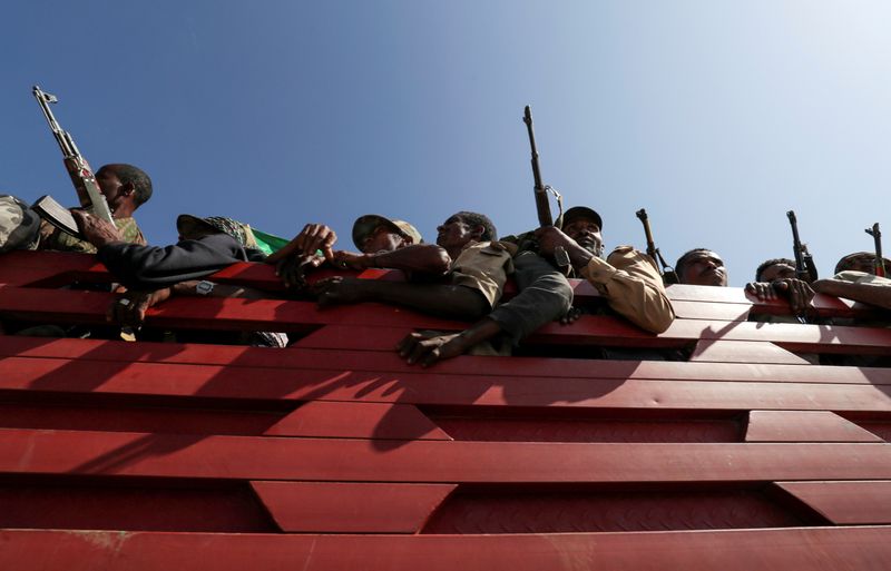 FILE PHOTO: FILE PHOTO: Members of Amhara region militias ride