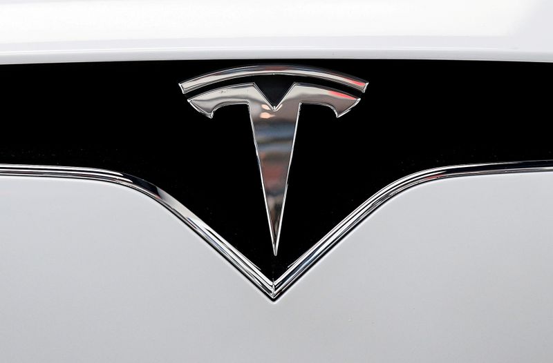 FILE PHOTO: The Tesla logo is seen on a car