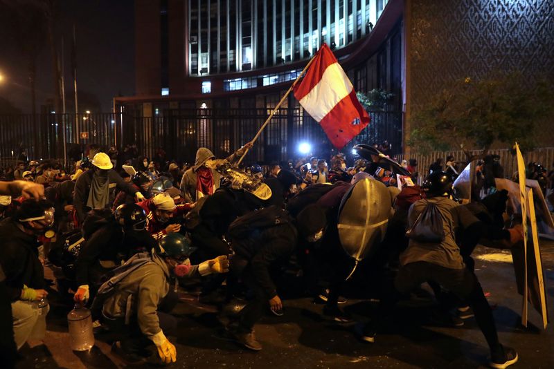 Demonstrators clash with police during protests that led to the