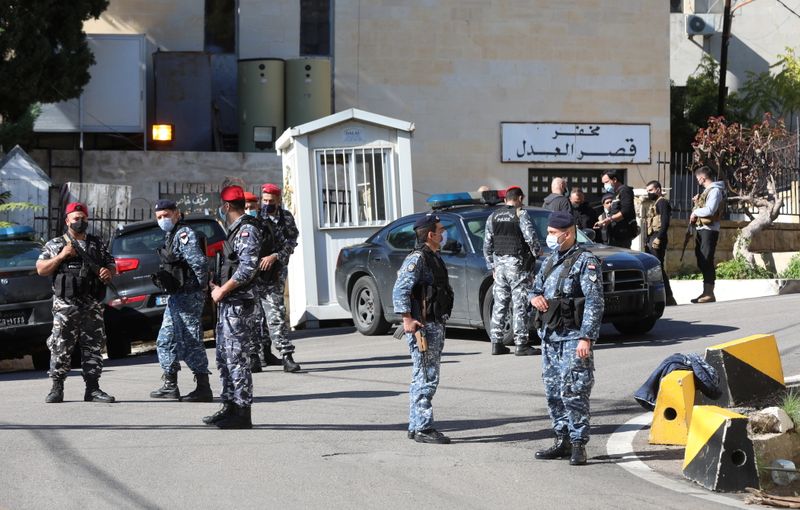 Members of the Lebanese police gather outside Baabda prison