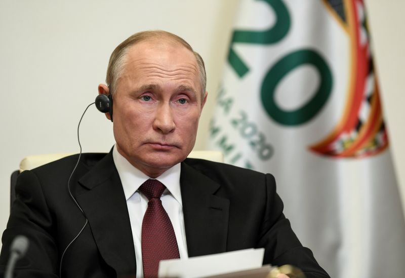 FILE PHOTO: Russian President Vladimir Putin takes part in a