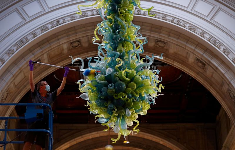 FILE PHOTO: A museum technician cleans the V&A Rotunda Chandelier