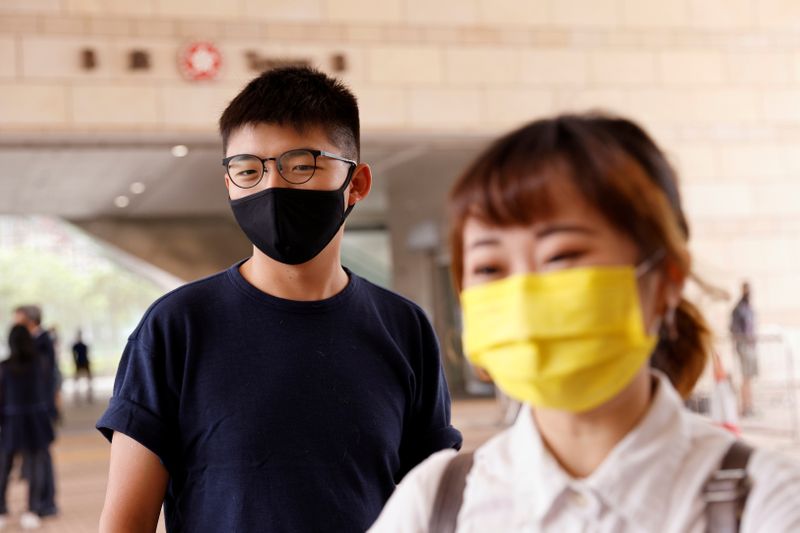 FILE PHOTO: Pro-democracy activists Joshua Wong  and Tiffany Yuen