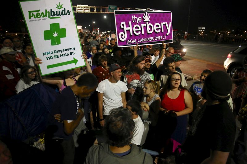 FILE PHOTO: Marijuana enthusiasts gather after midnight to celebrate the
