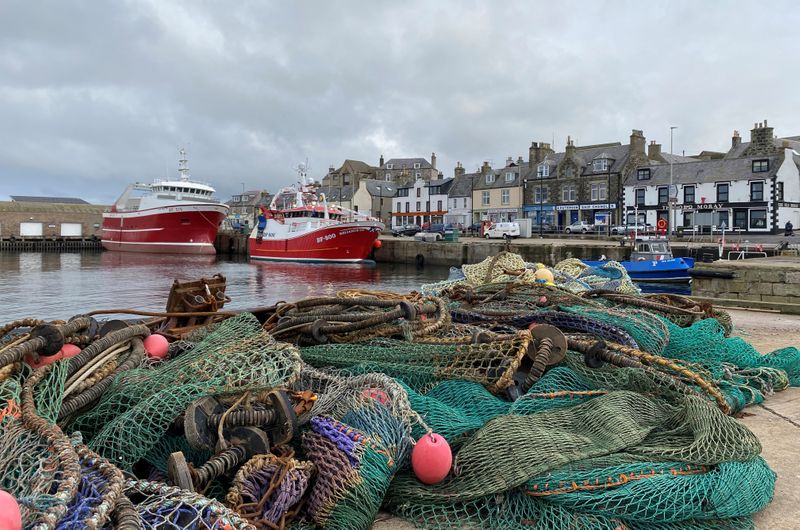 FILE PHOTO: Fishing boat sits docked in Macduff, Aberdeenshire