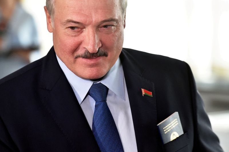 FILE PHOTO: Belarusian President Alexander Lukashenko visits a polling station