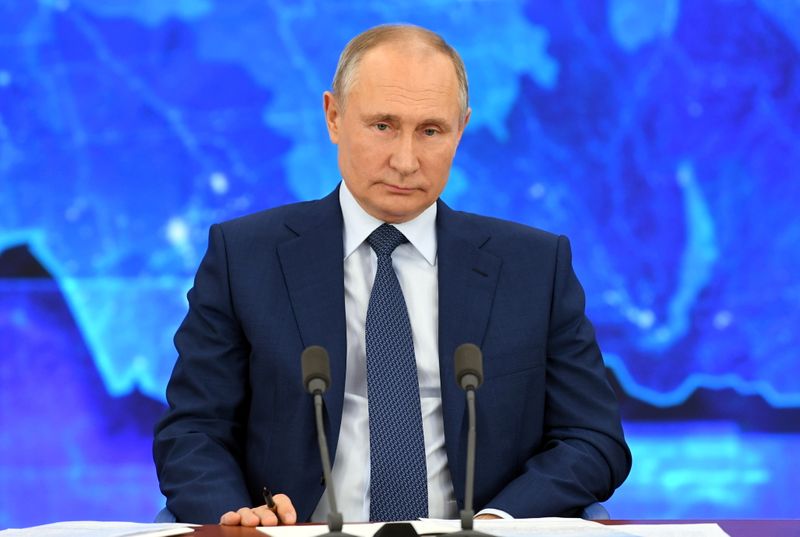 Russian President Vladimir Putin attends his annual end-of-year news conference
