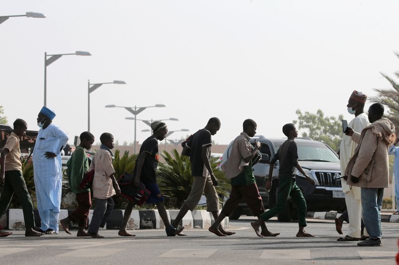 Freed Nigerian schoolboys walk after they were rescued by security