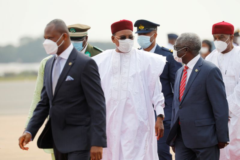 Niger’s President Mahamadou Issoufou arrives at the airport for the