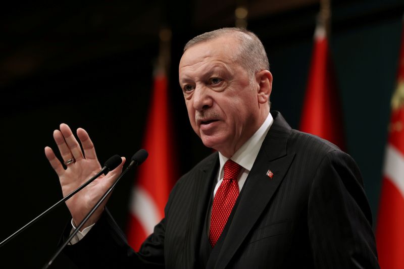 FILE PHOTO: Turkish President Erdogan talks during a news conference