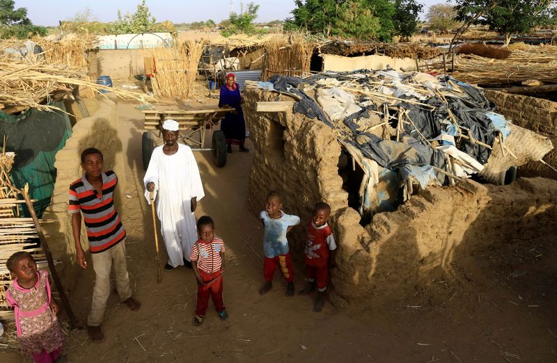 FILE PHOTO: An internally displaced Sudanese family poses for a