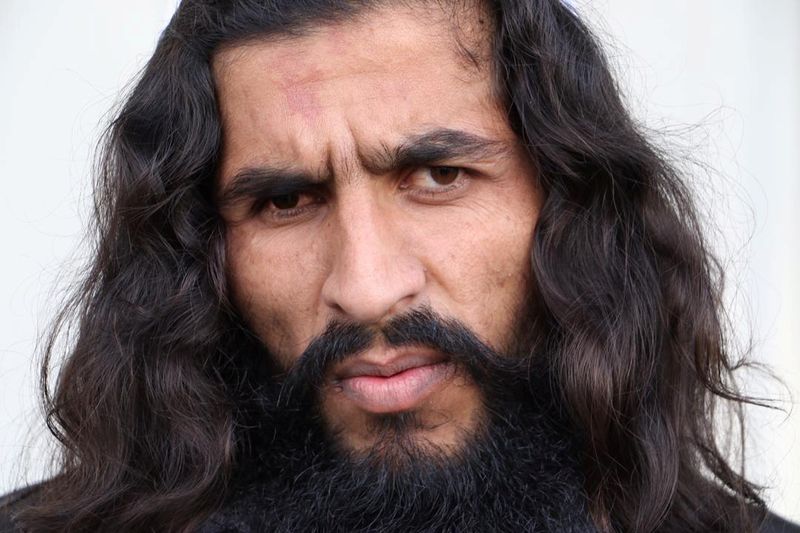 A newly freed Taliban prisoner looks on at Bagram prison,