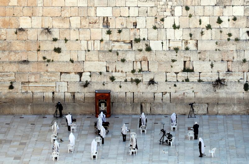 Jewish worshippers pray at Western Wall on Passover amid COVID-19