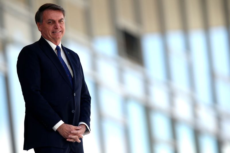 Brazil’s President Jair Bolsonaro reacts as he stands at the