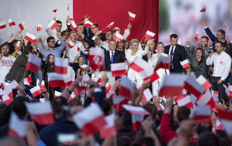 Polish President Duda greets his supporters after the second round