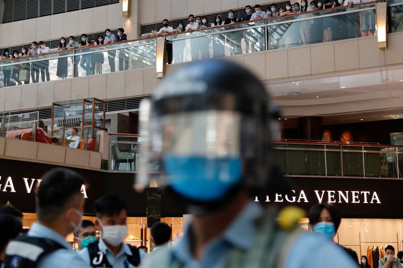 FILE PHOTO: Riot police patrol at a shopping mall during