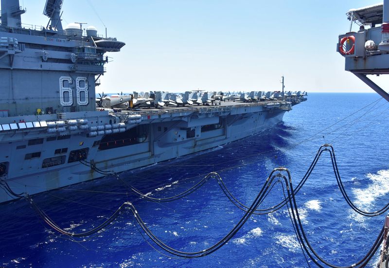 U.S. Navy aircraft carrier USS Nimitz receives fuel from the