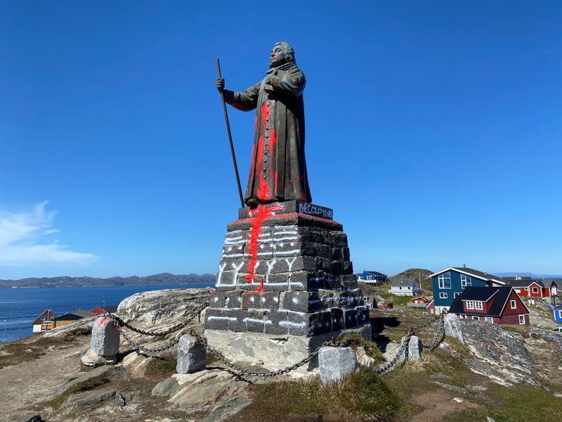 The statue of Hans Egede is seen after being vandalized