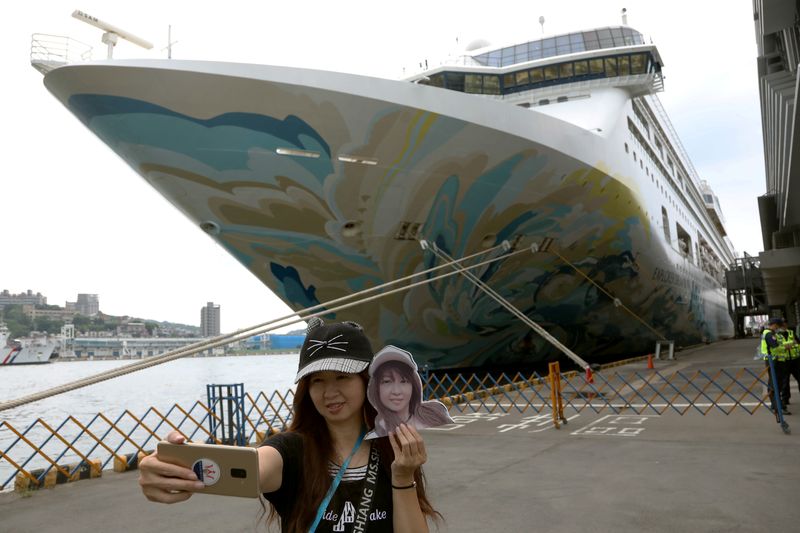 A woman takes a selfie in front of the Explorer