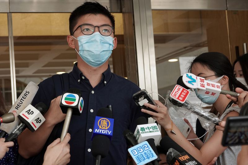 Pro-democracy activist Joshua Wong speaks to the media at the
