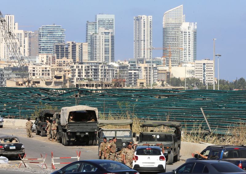 Lebanese soldiers are seen near the site of Tuesday’s blast