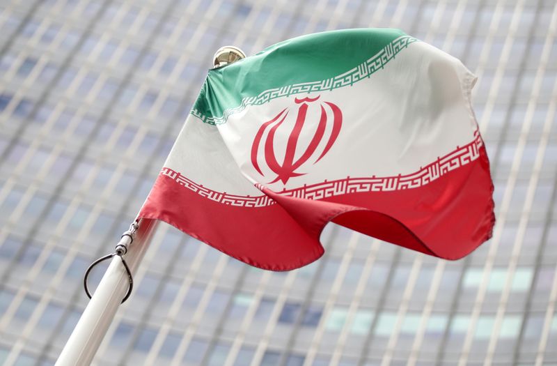 The Iranian flag flutters in front the International Atomic Energy