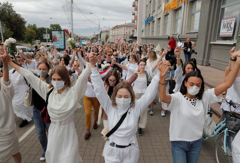 Women take part in a demonstration against police violence in