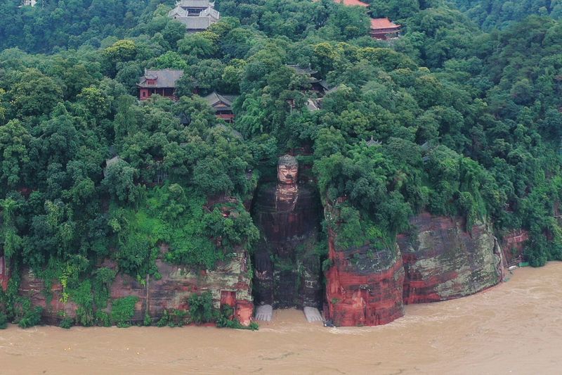 Floodwater reaches the Leshan Giant Buddha’s feet following heavy rainfall,