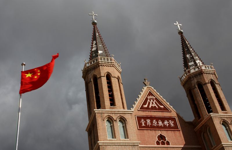 FILE PHOTO: The Chinese national flag flies in front of