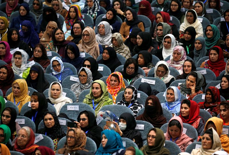Afghan women attend a consultative grand assembly, known as Loya