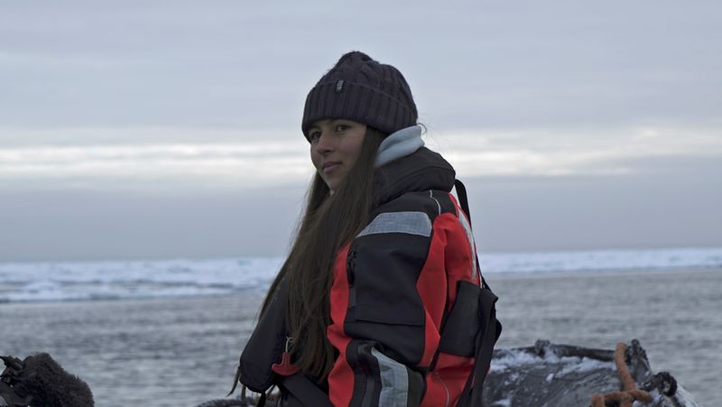 Environmental activist and campaigner Mya-Rose Craig sits on a boat