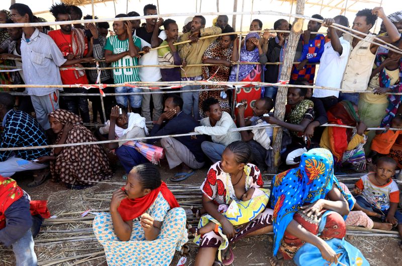 FILE PHOTO: Ethiopians receive supplies at the Um-Rakoba camp on