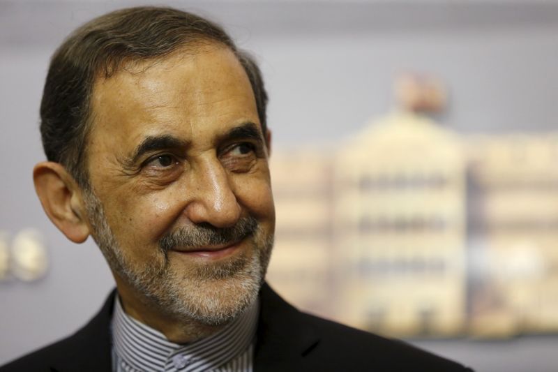 Ali Akbar Velayati smiles as he listens to questions from