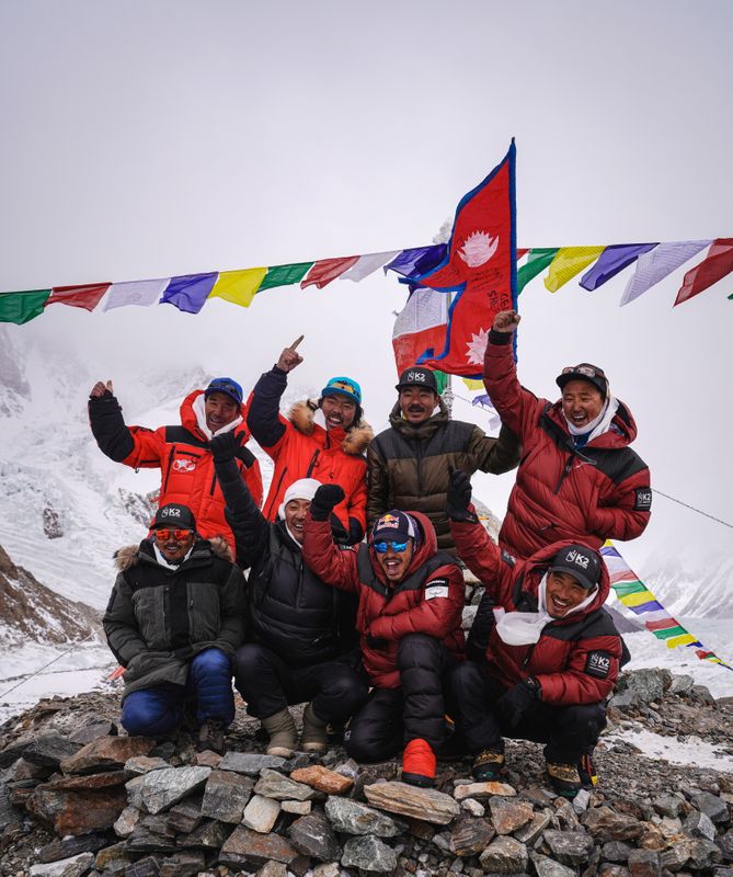 Team of climbers from Nepal is seen during the Puja