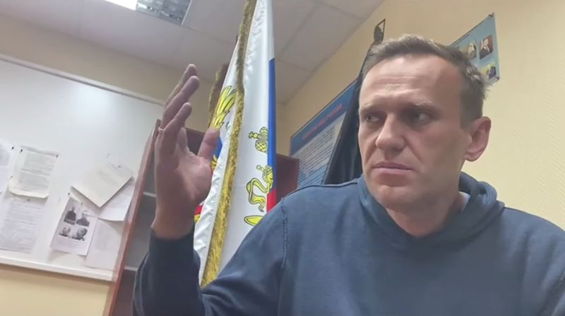 Russian opposition leader Alexei Navalny speaks as he waits for