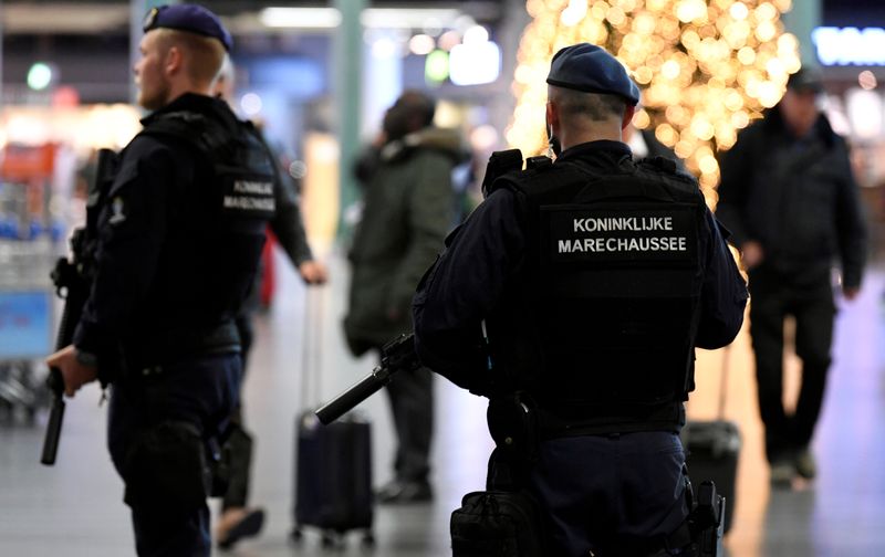FILE PHOTO: Dutch police patrol at Amsterdam’s Schiphol airport