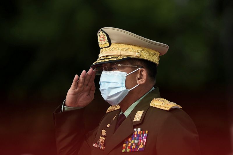 Myanmar’s Army Chief Min Aung Hlaing salutes during the Martyrs’