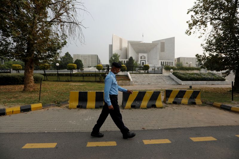 FILE PHOTO: A policeman walks past the Supreme Court building