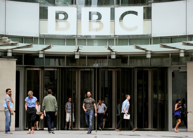 FILE PHOTO: People arrive and depart from Broadcasting House, the