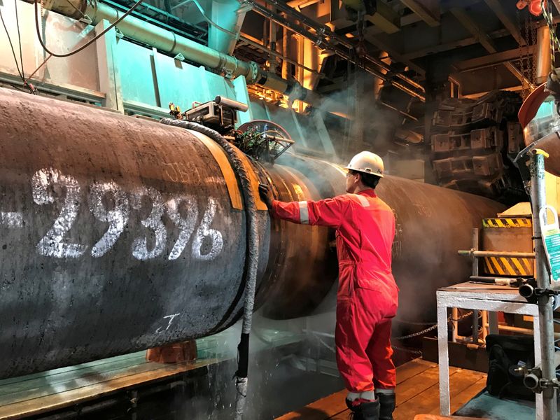 FILE PHOTO: A specialist works onboard the Allseas’ deep sea