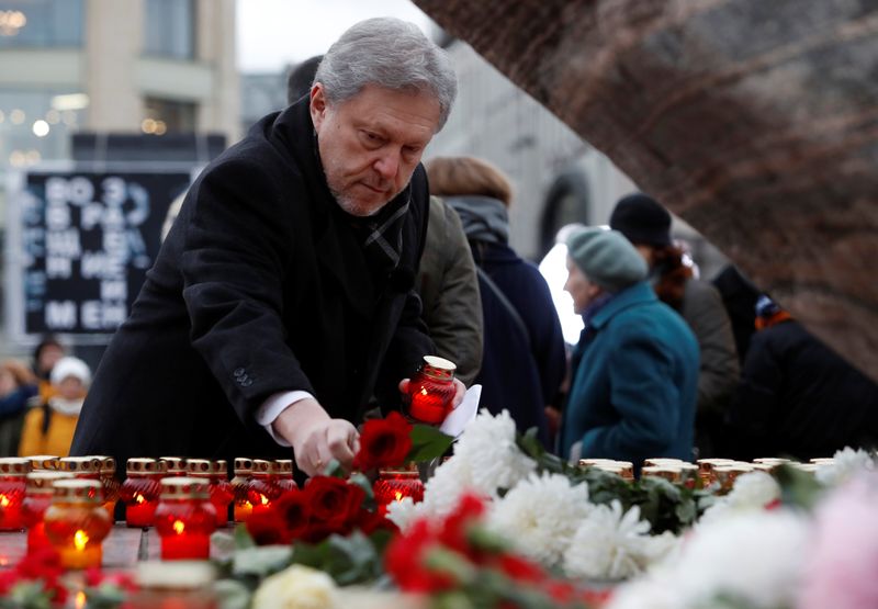 FILE PHOTO: Opposition politician Yavlinsky lays flowers at the “Solovetsky”