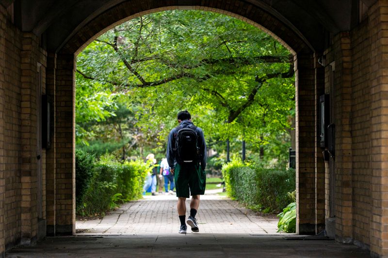 Students walk on the grounds of the University of Toronto