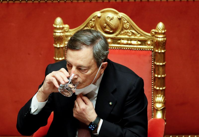 FILE PHOTO: Italy’s Prime Minister Mario Draghi attends a debate